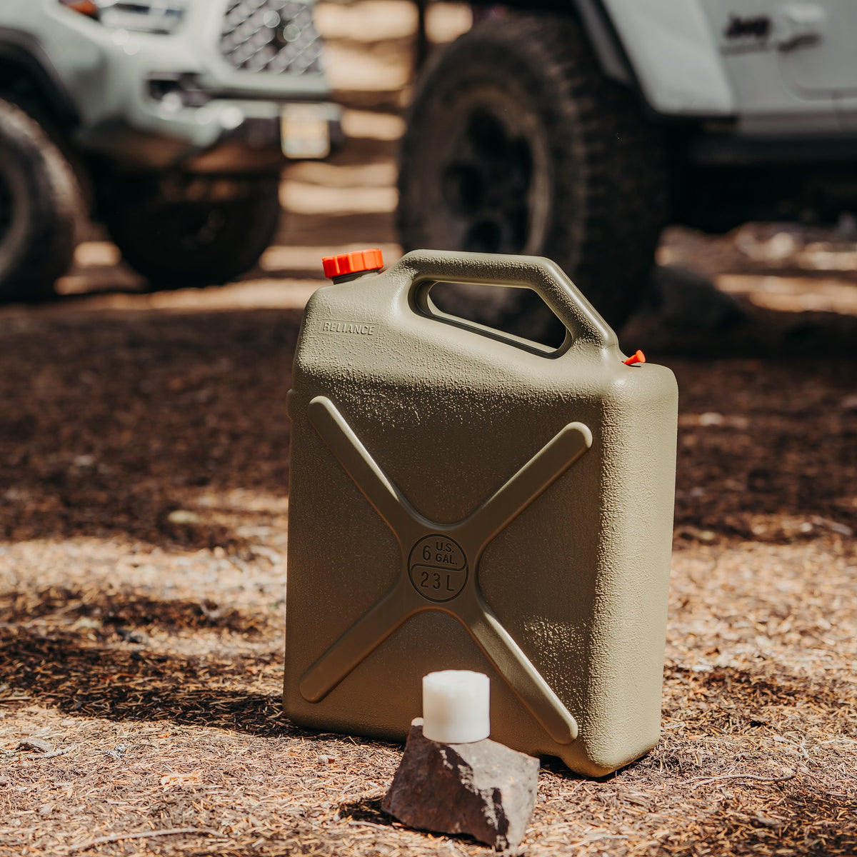 Desert Patrol adapter only sitting on rock in front of Desert Patrol water container
