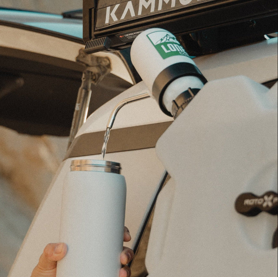 RotopaX water pump adapter kit mounted on vehicle dispensing water