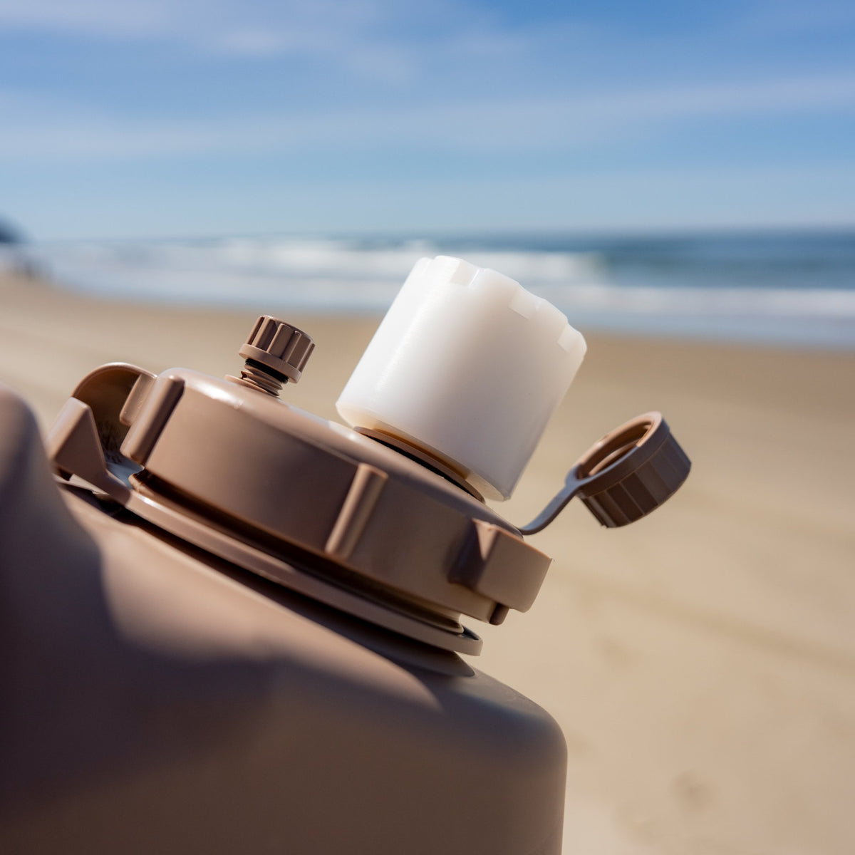 Military adapter on military can at the beach
