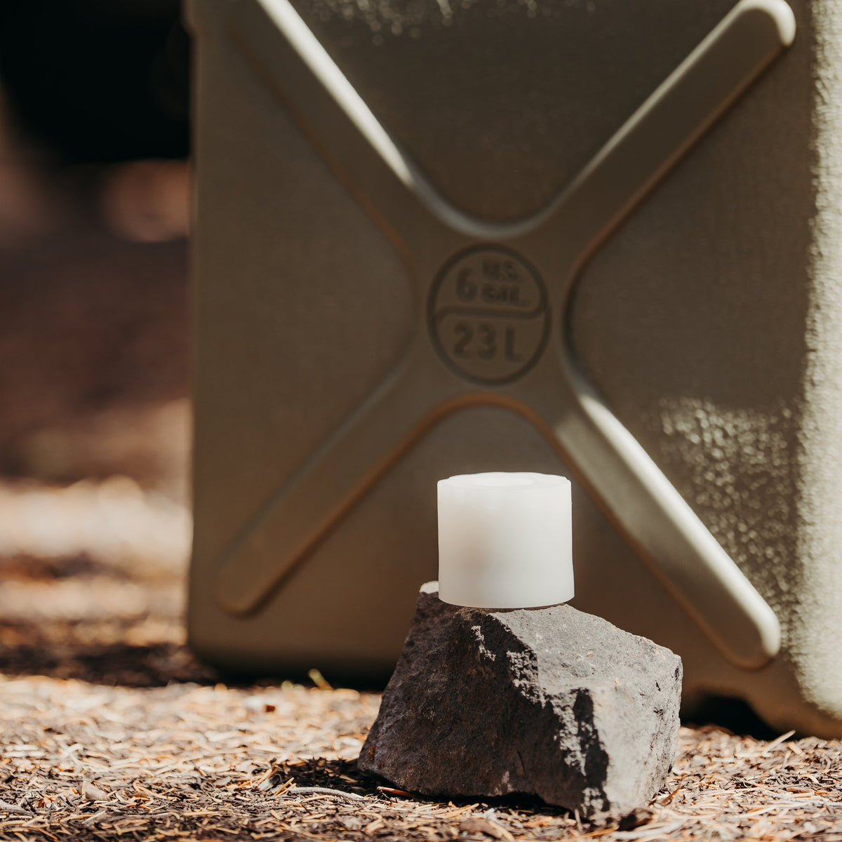 Rhino-Pak adapter only on rock in front of 6 gallon container